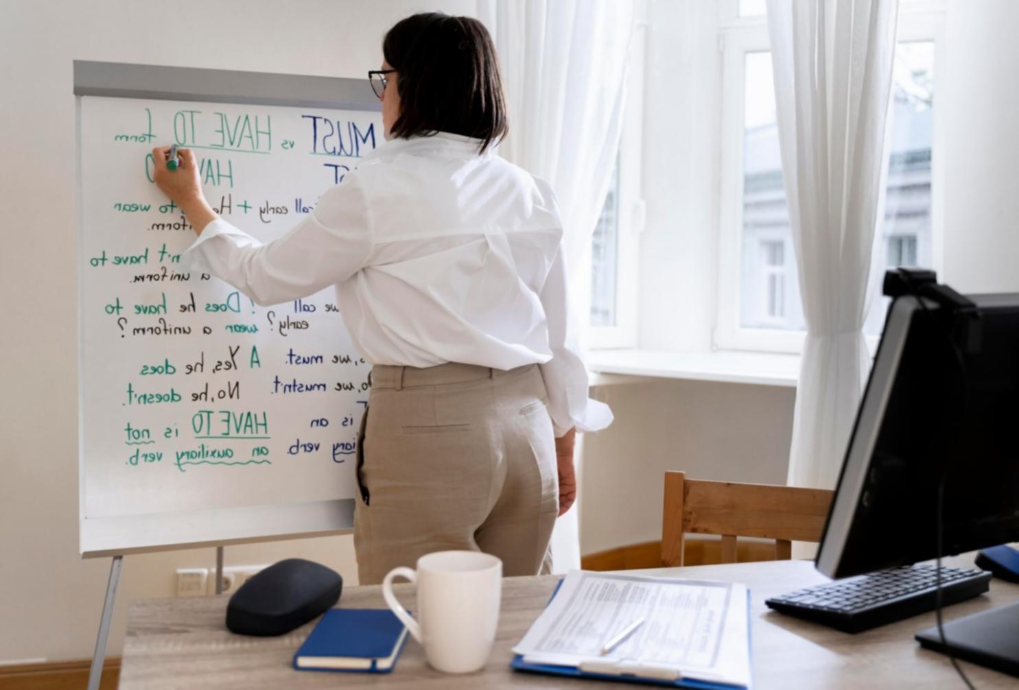 Student working on investment analysis with financial charts displayed on screen